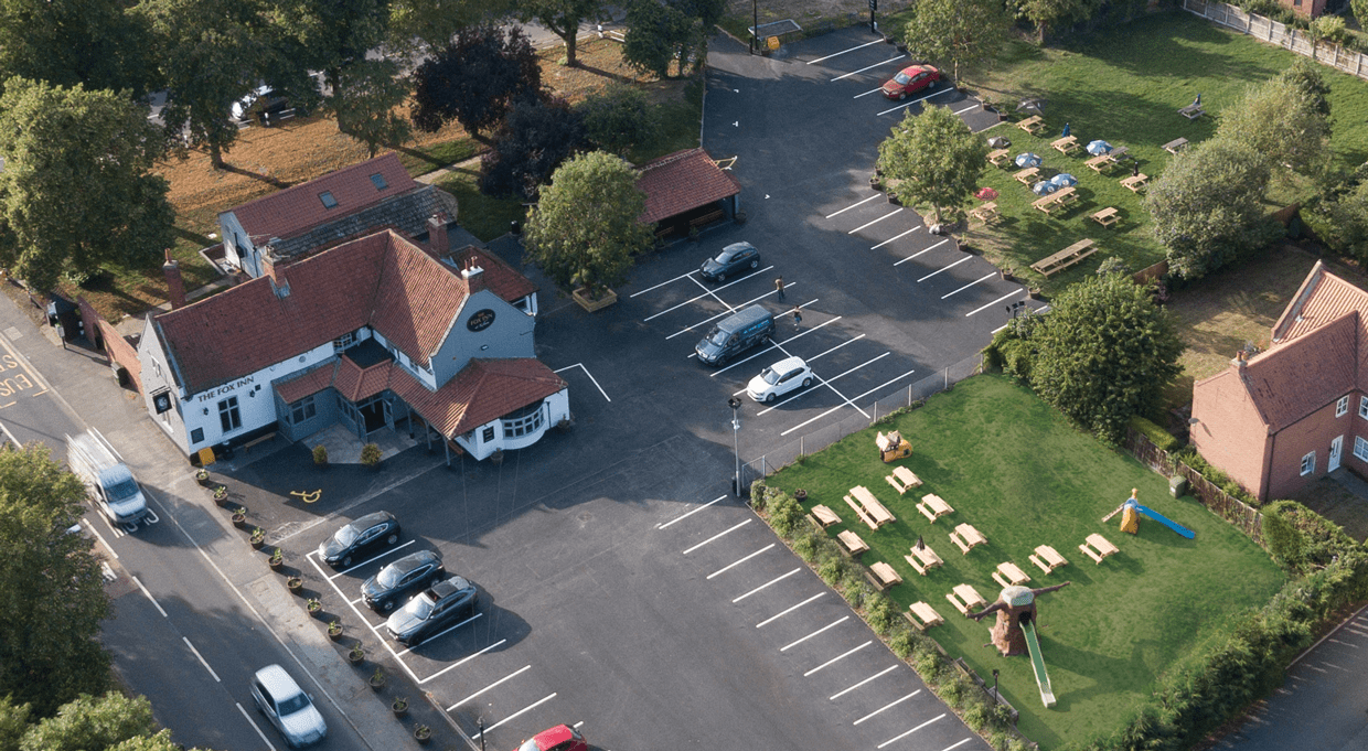 Aerial view of The Fox Inn, its car park and beer gardens in Kelham
